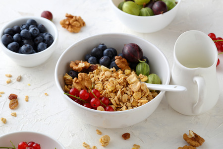granola in bowl with  summer berries, food close-upの写真素材