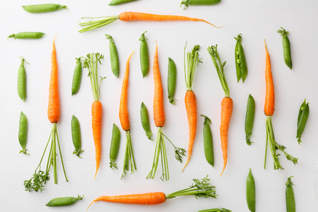 raw carrots and green peas pattern, healthy foodの写真素材