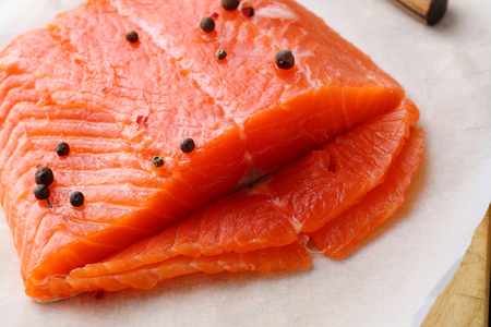 Raw salmon steak sliced for cooking. Food close-upの写真素材