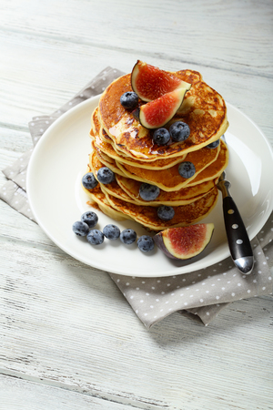 Pancakes with fruits on white wood, food closeupの写真素材
