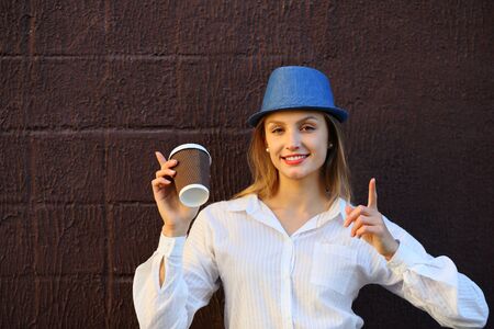 Happy young woman joy with coffeeの写真素材