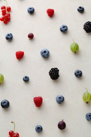 Berry pattern on concrete background, top view