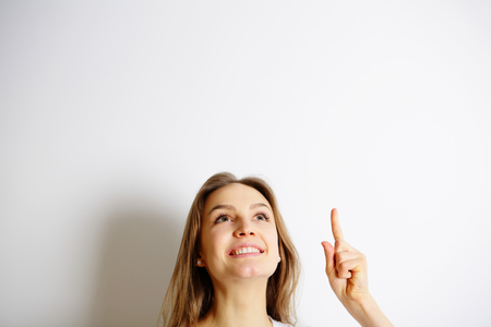 Young smiling woman have an ideaの写真素材