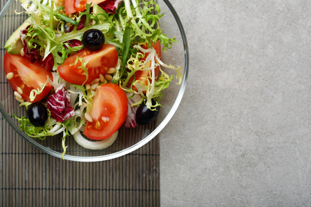 Fresh tomato salad on glass plate, copy-spaceの写真素材
