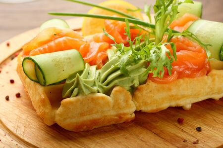 Soft waffles with salmon and salad, food closeupの写真素材