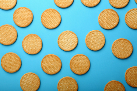 Crispy Cracker cookies on blue background, food aboveの写真素材