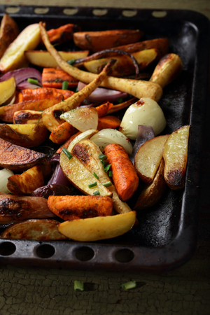 Roasted vegetables mix on tray, food closeupの写真素材