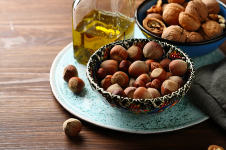 hazelnut on wood background, food closeupの写真素材