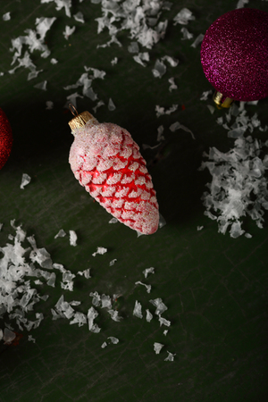 Red christmas  cone decorations on woodの写真素材