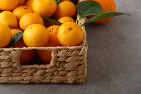 Fresh citrus fruits in basket, food closeupの写真素材