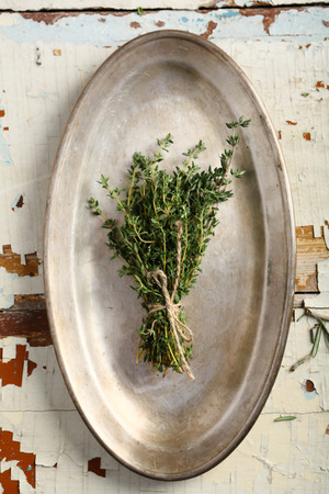 Bunch of thyme on platter, flat layの写真素材