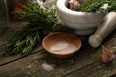 Cooking wood background with herbsの写真素材