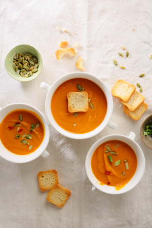 hot pumpkin cream soup and croutons, food flat layの写真素材