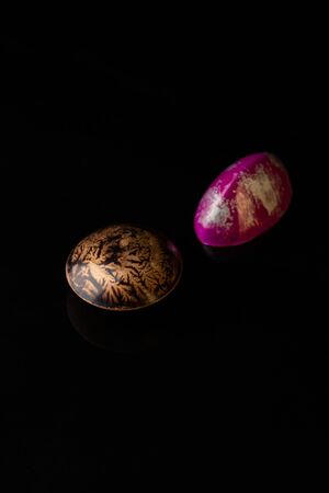 Chocolate bonbons on black backgroundの写真素材