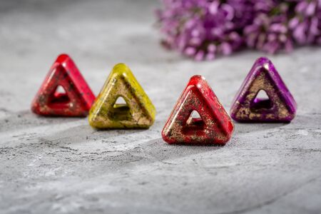 Chocolate candy on concrete, bonbons and flower