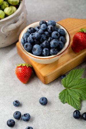 Fresh blueberry in small bowl close-upの写真素材