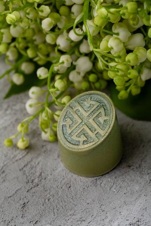 Green modern chocolate bonbon and spring flowersの写真素材