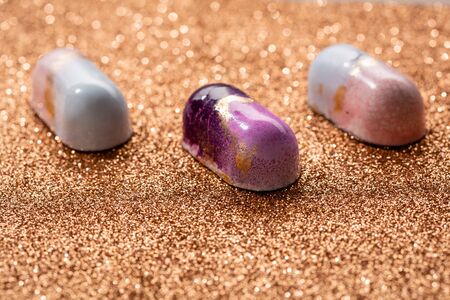 chocolate bonbons close-up on brilliant backgroundの写真素材