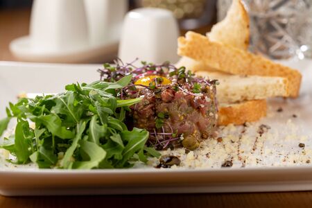 Tartar with eggs and toasted bread close-upの写真素材