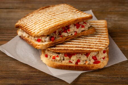 Two takeaway sandwiches close-up on woodの写真素材