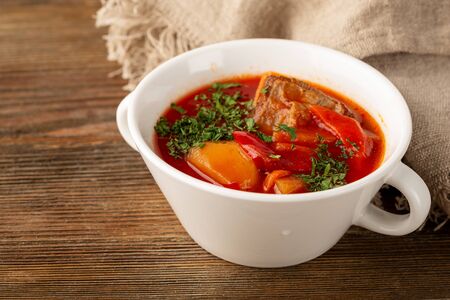 Beetroot rustic soup borsch close-up in white bowlの写真素材