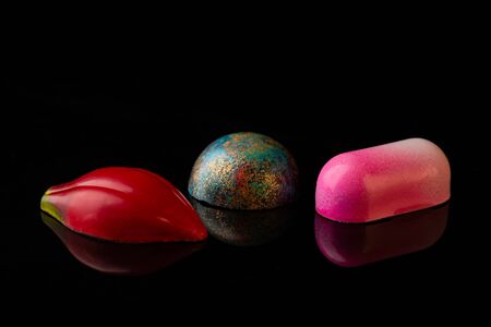 Chocolate candies collection on blackの写真素材