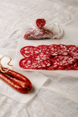 Sliced pork salami and sausage close-upの写真素材