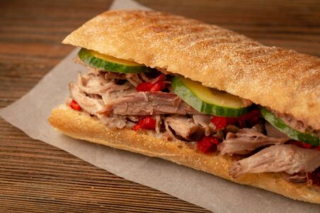 Takeaway sandwich close-up on woodの写真素材