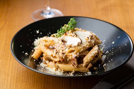 Penne pasta with mushrooms sauce close-upの写真素材