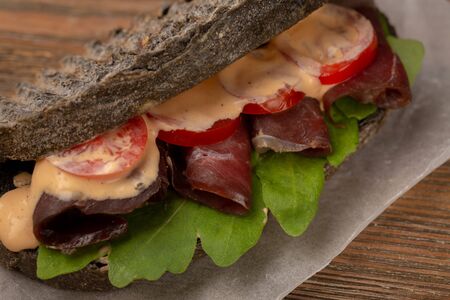 Sandwich with tomato and meat close-up, healthy foodの写真素材