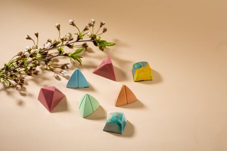Spring collection of chocolate bonbon and cherry flowersの写真素材