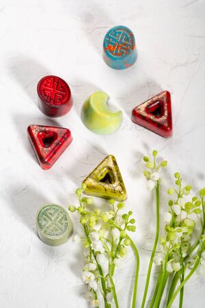 Chocolate bonbons collection and flowersの写真素材