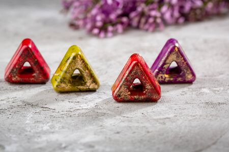 Chocolate bonbon set close-up and lilac flowersの写真素材