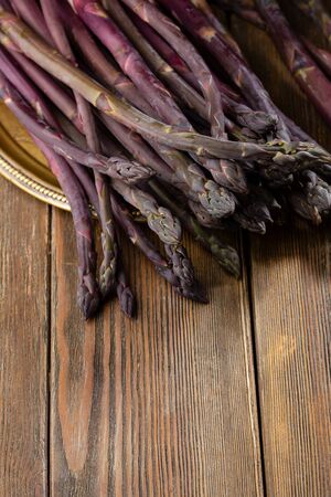 Organic asparagus on wooden boardsの写真素材