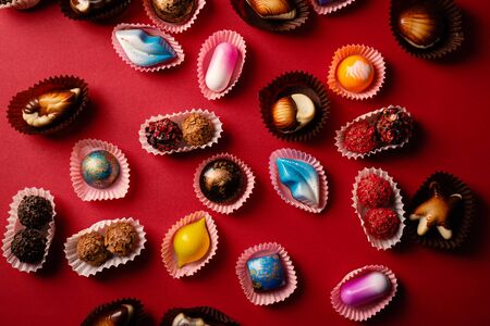 Chocolate Candy set on red background. food patternの写真素材