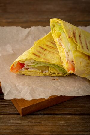 Burrito with tuna close-up on boardの写真素材