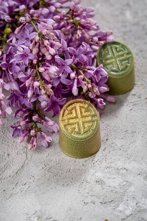 Chocolate bonbon close-up and flowersの写真素材