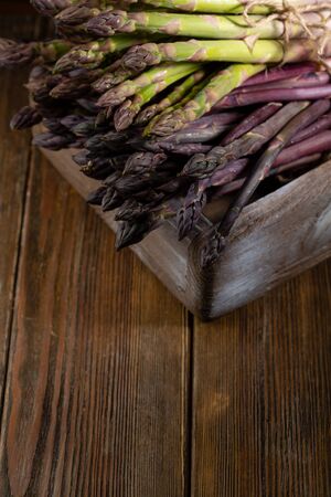 Organic asparagus on wooden boards, foodの写真素材