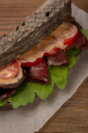 Sandwich with tomato and meat close-upの写真素材