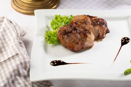 Portion of grilled meat on plateの写真素材
