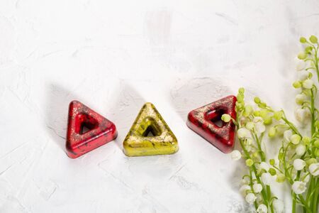 Chocolate candies and 
lily of the valleyの写真素材