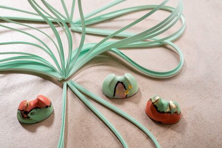 Still life with modern chocolate bonbons and paperの写真素材