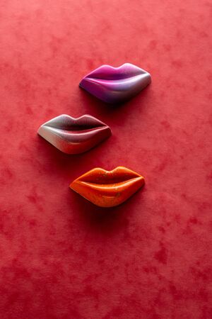 Red lips candy on red backgroundの写真素材