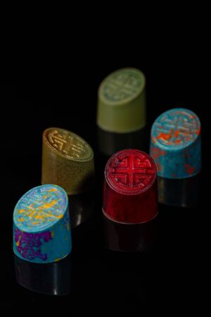 Modern chocolate candy set on black backgroundの写真素材