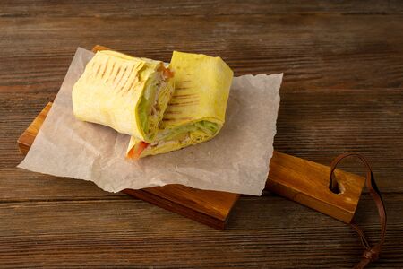 Burrito with tuna on boardの写真素材
