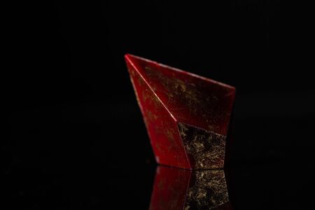 Beautiful modern chocolate candy on blackの写真素材