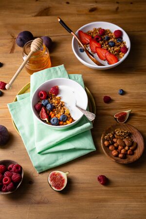 Granola  with fruits on wooden tableの写真素材