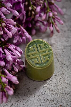 Chocolate bonbon close-up and lilacの写真素材