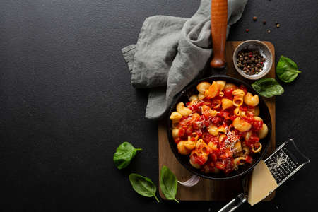 Pasta with tomato sauce and cheese in pan top viewの写真素材