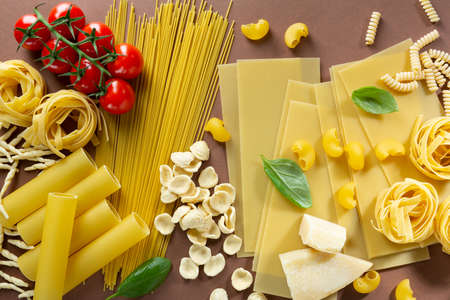 Different pasta and ingredients food backgroundの写真素材